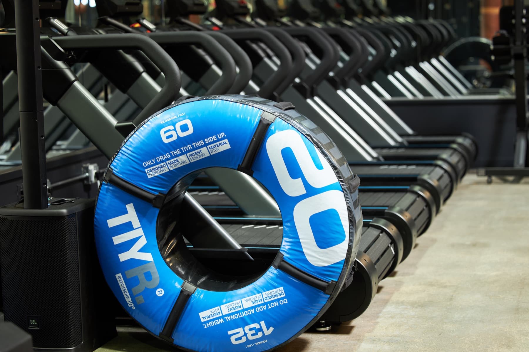 Bumper plates racked in the weight room at Craft Boxing Club Calabasas