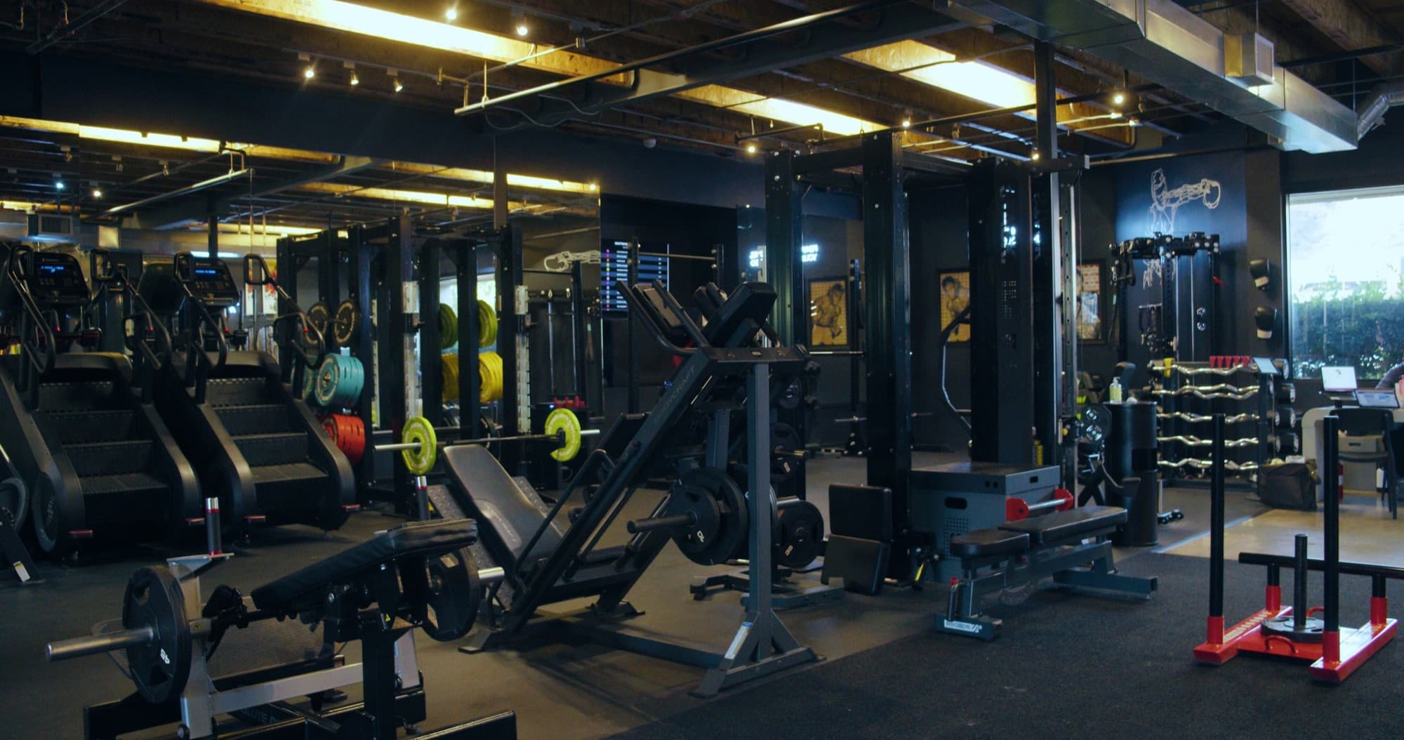 Squat racks, cable machines and sleds in the weight room